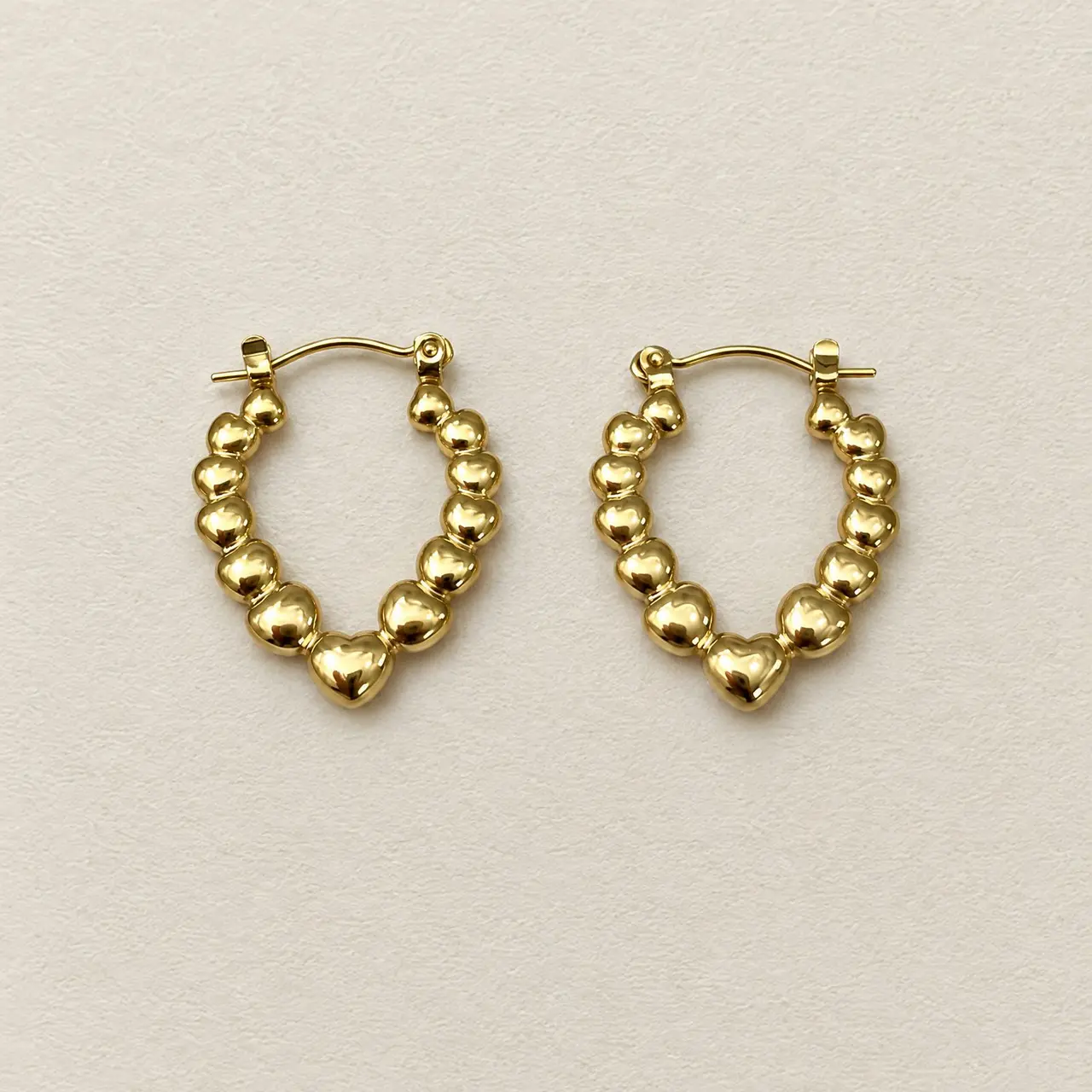 Fotografía de Arete Aro Corazones Gold — Imagen 1 de 1
